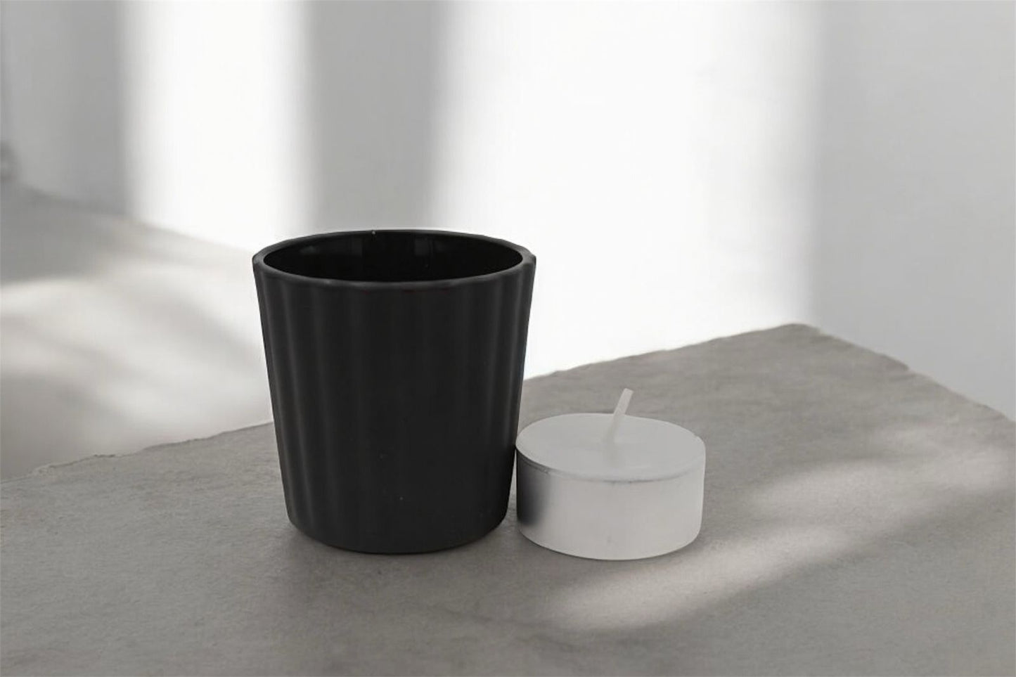 Vela tea light en vaso votivo de cristal