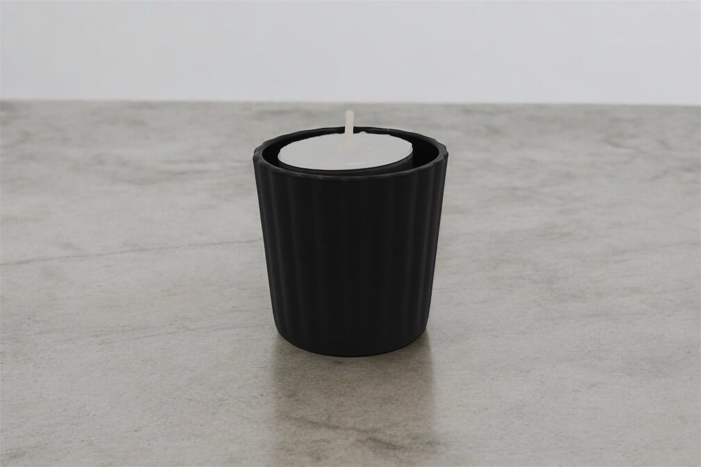 Vela tea light en vaso votivo de cristal