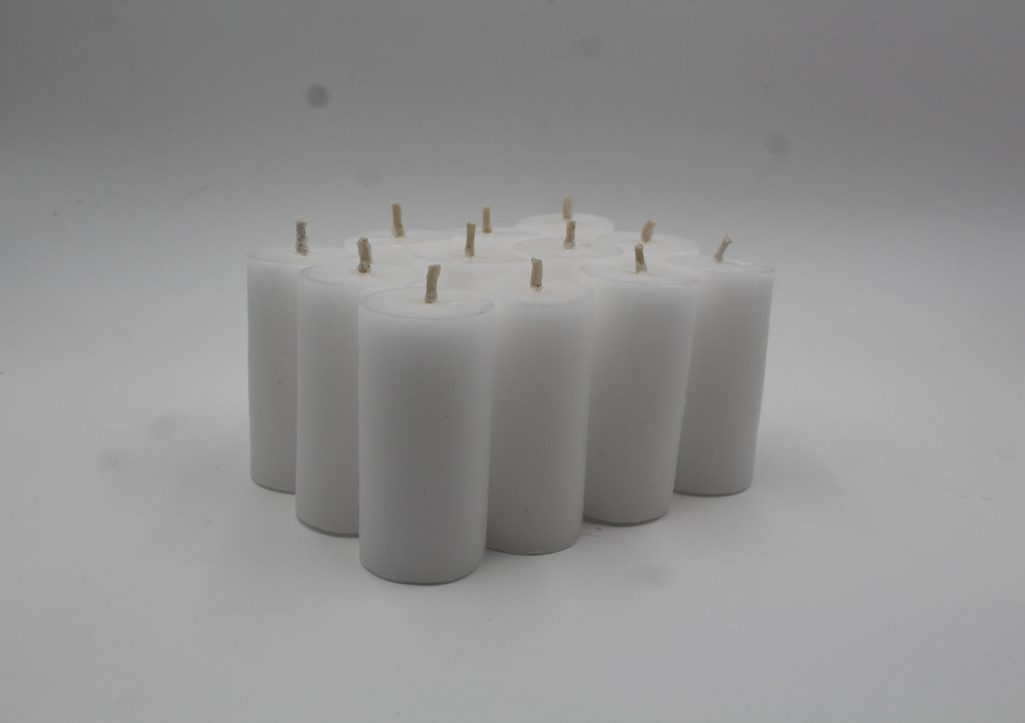 12 velas en forma de cirio 4x7.5 cm