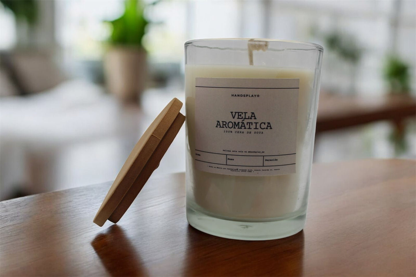 Vela aromática de cera de soya en vaso de cristal