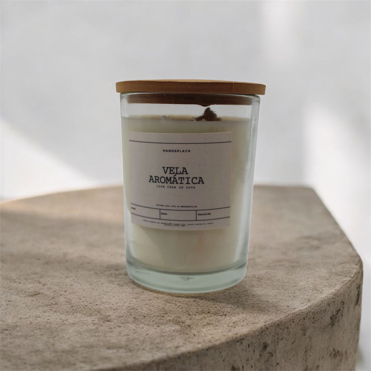 Vela aromática de cera de soya en vaso de cristal
