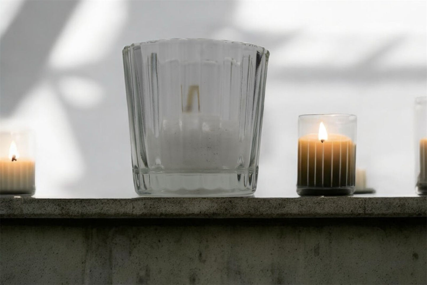 Vela flotante en vaso estriado