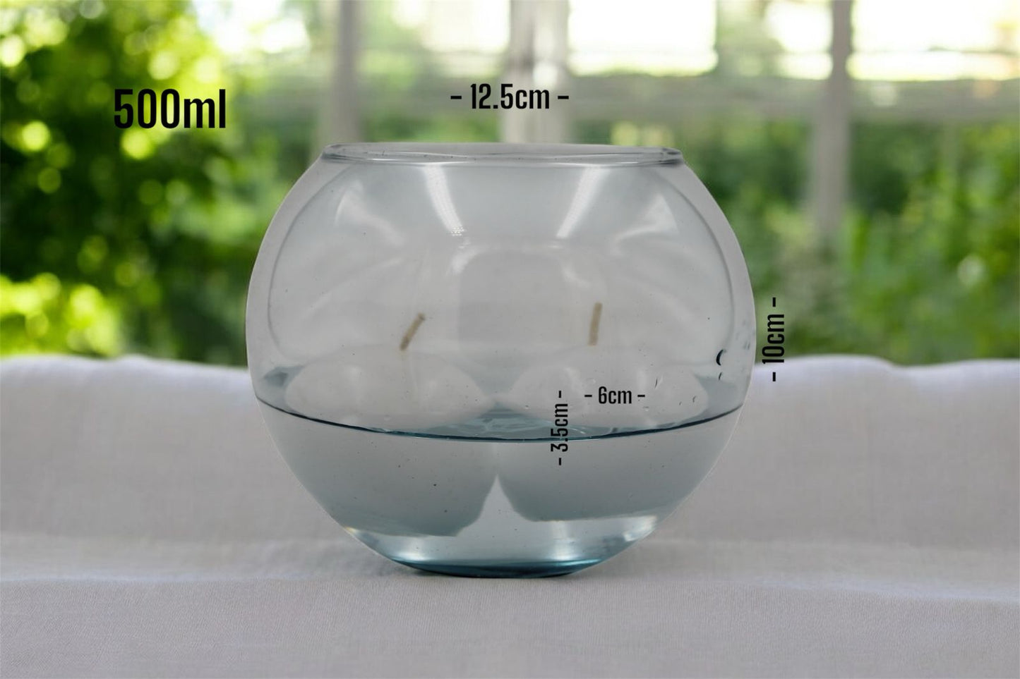 Velas en peceras de cristal